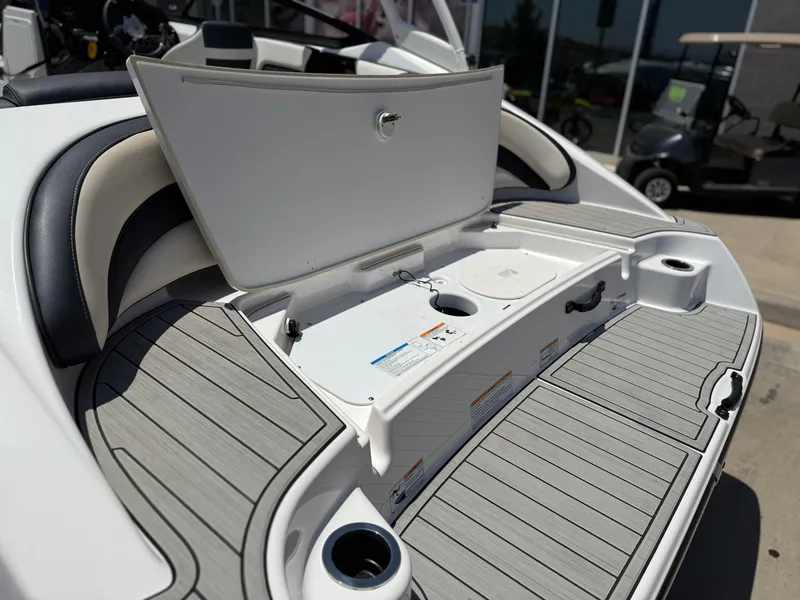 Slide: The Image of 2021 Yamaha AR195 boat with open storage compartment and sleek deck design. - 15