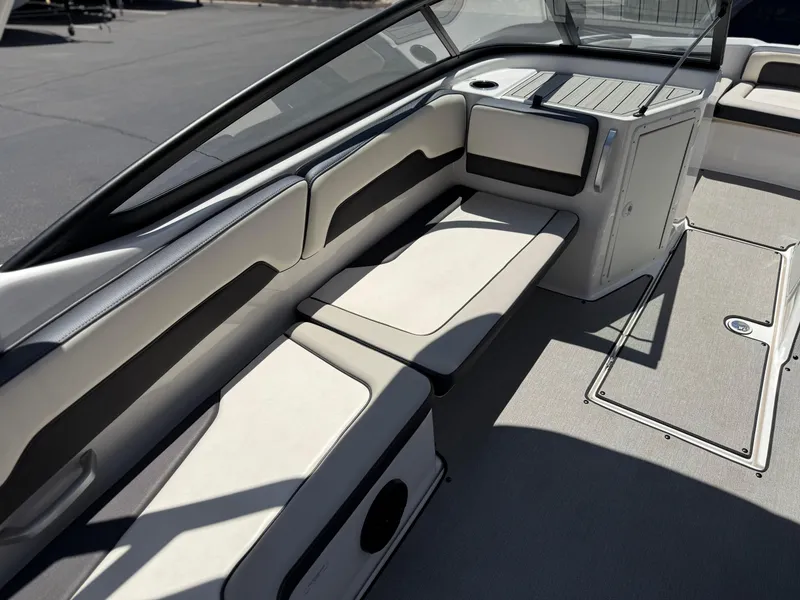 Slide: The Image of 2021 Yamaha AR195 boat interior with cushioned seating and storage compartments. - 19