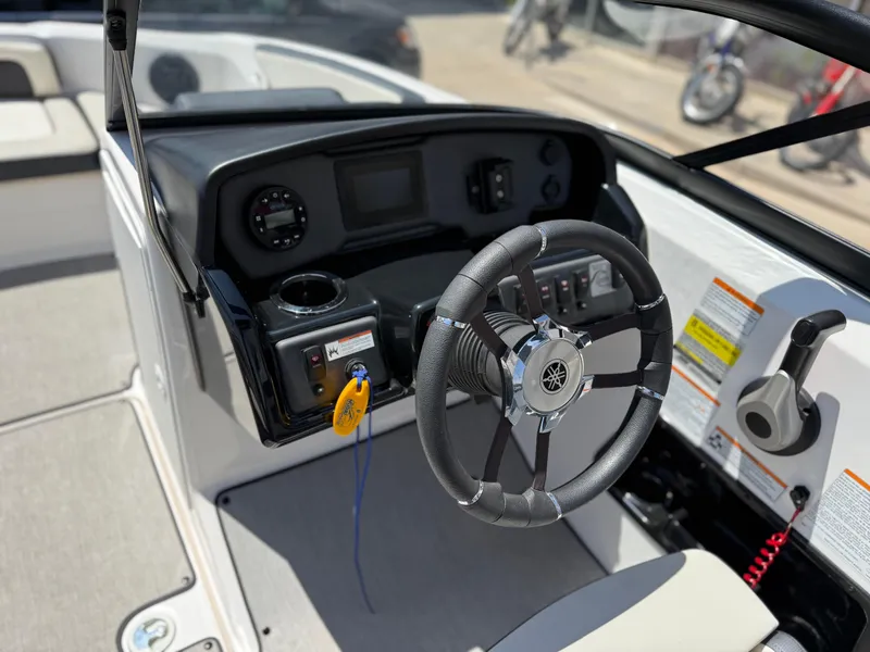 Slide: The Image of 2021 Yamaha Boats AR195 steering console with modern controls and sleek design. - 20