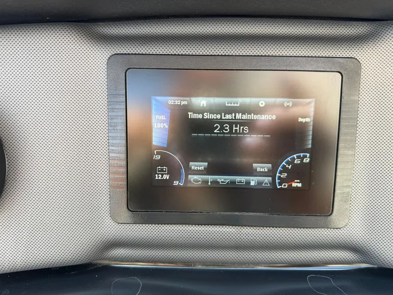 Slide: The Image of Dashboard display of 2021 Yamaha Boats AR195 showing maintenance time and fuel level. - 27