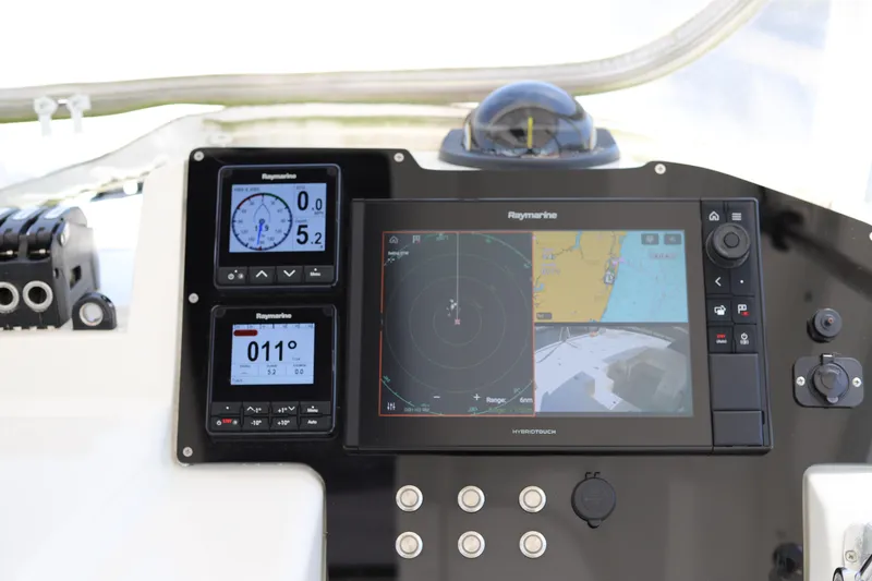 Slide: The Image of Control panel of a 2020 Robertson Leopard boat with navigation displays. - 11