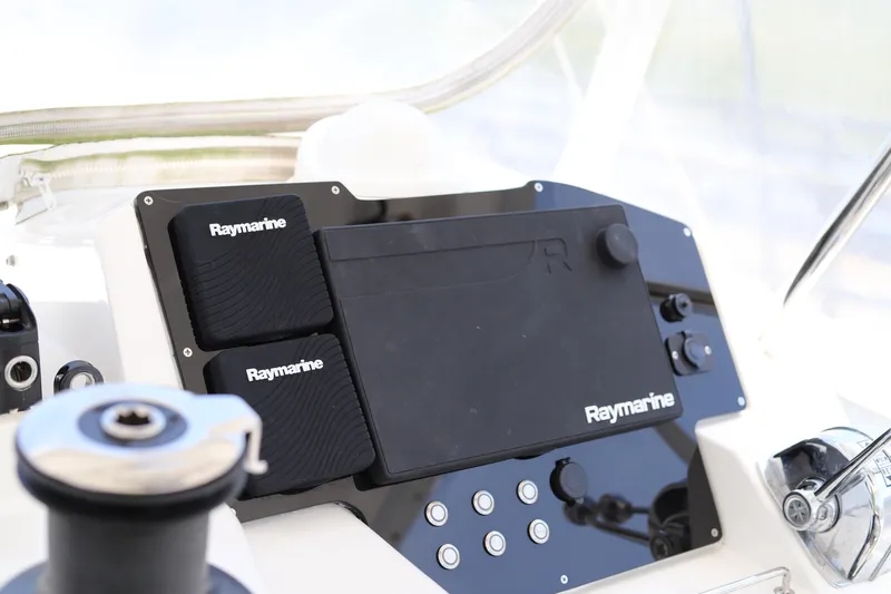 Slide: The Image of Control panel of a 2020 Robertson Leopard boat featuring Raymarine navigation equipment. - 13
