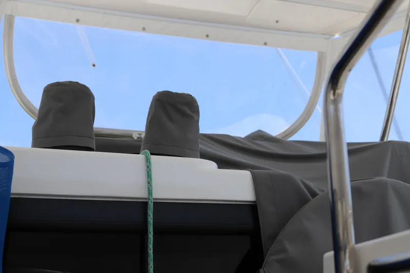 Slide: The Image of Covered equipment on a 2020 Robertson Leopard boat, with clear sky background. - 19