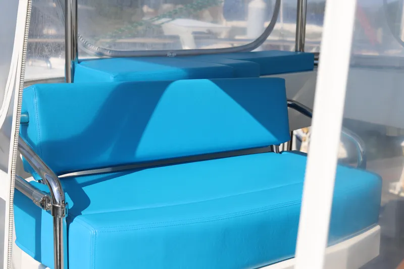 Slide: The Image of Blue seating on a 2020 Robertson Leopard boat, featuring sleek metal frames. - 22