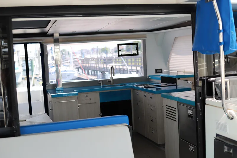 Slide: The Image of Modern kitchen interior of 2020 Robertson Leopard yacht with blue countertops and sleek design. - 26