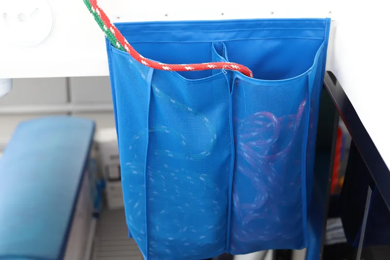Slide: The Image of Blue mesh storage bag with red rope on Robertson Leopard 2020 boat. - 35