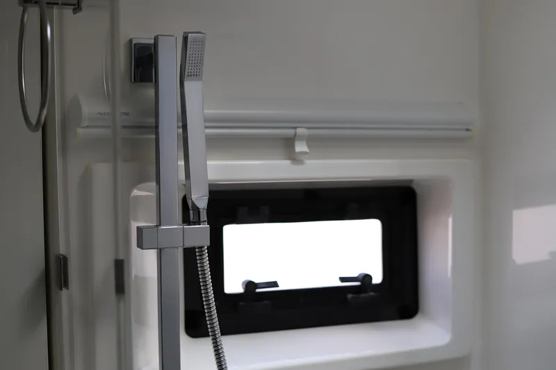 Slide: The Image of Modern shower area in 2020 Robertson Leopard yacht, featuring sleek fixtures and window. - 45