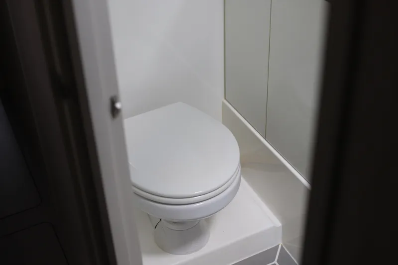 Slide: The Image of Compact bathroom in 2020 Robertson Leopard model, featuring a modern white toilet. - 46