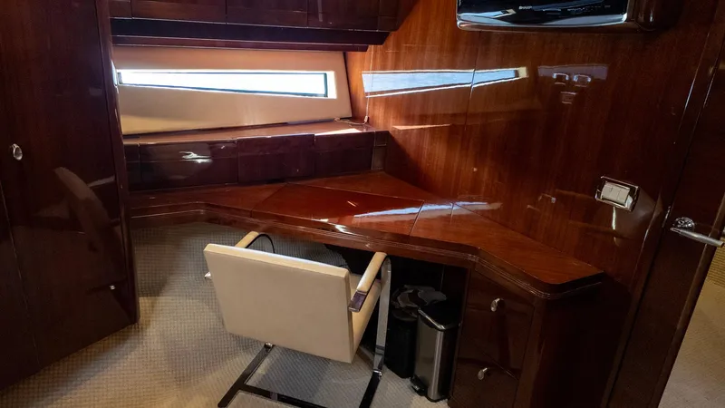 Slide: The Image of Luxurious wood-paneled yacht interior with desk and chair, Savannah 54, 2008 model. - 11