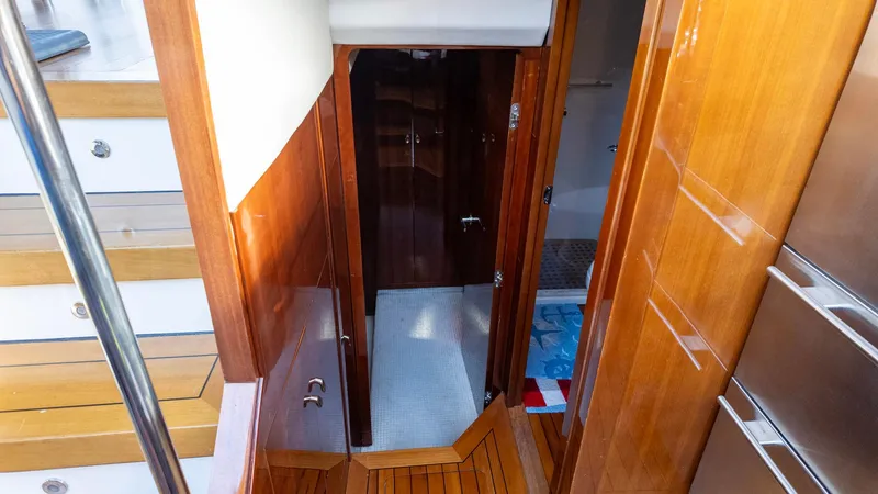 Slide: The Image of Interior of 2008 Savannah 54 yacht with wooden finishes and stairs. - 14