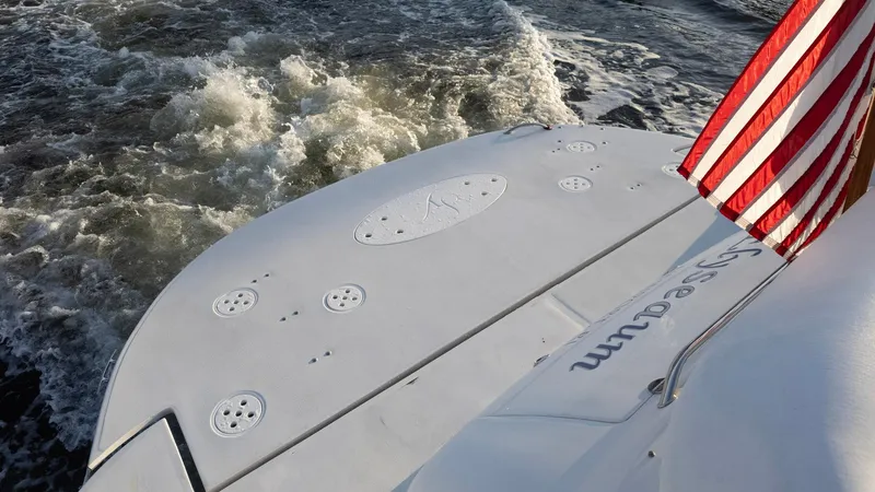 Slide: The Image of Savannah 54 yacht stern with American flag, cruising through waves, 2008 model. - 33