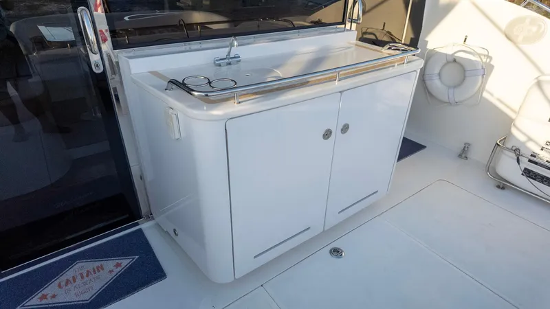 Slide: The Image of Outdoor kitchenette on 2008 Savannah 54 yacht with sink and storage. - 36
