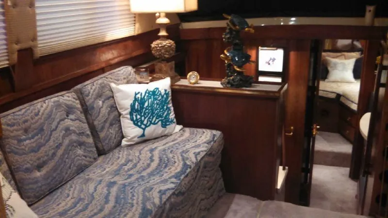 Slide: The Image of Interior of a 1973 Trojan F-32 yacht with cozy seating and nautical decor. - 8