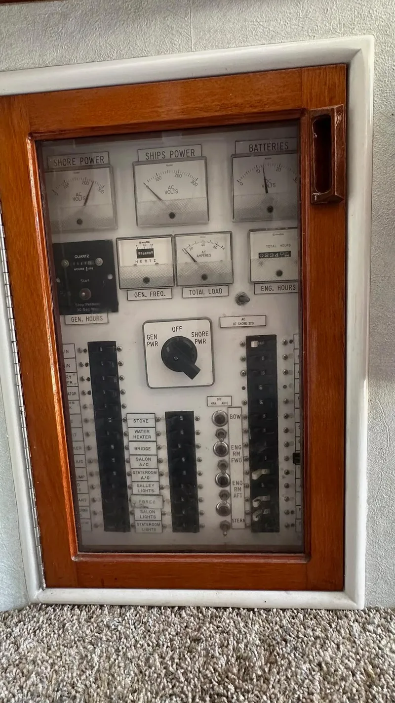 Slide: The Image of Electrical panel of a 1979 Buddy Davis 46 Convertible boat with wooden frame. - 16
