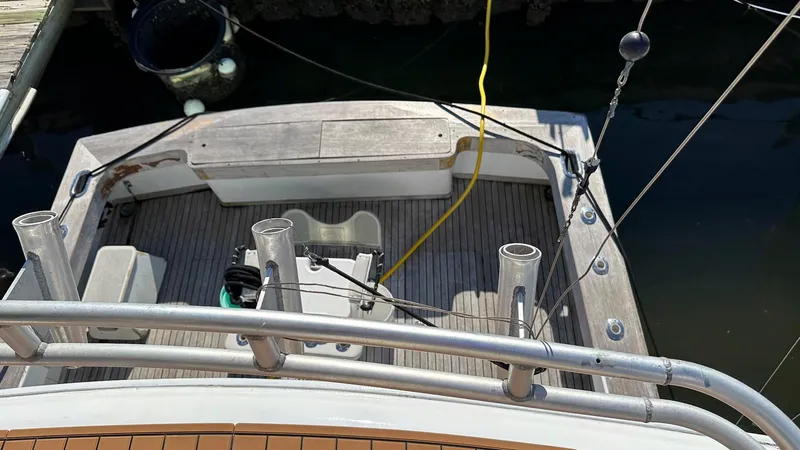 Slide: The Image of 1979 Buddy Davis 46 Convertible boat deck with fishing rod holders and equipment. - 3