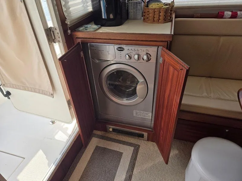 Slide: The Image of Washing machine inside 2015 American Tug 365 Flybridge yacht interior. - 18