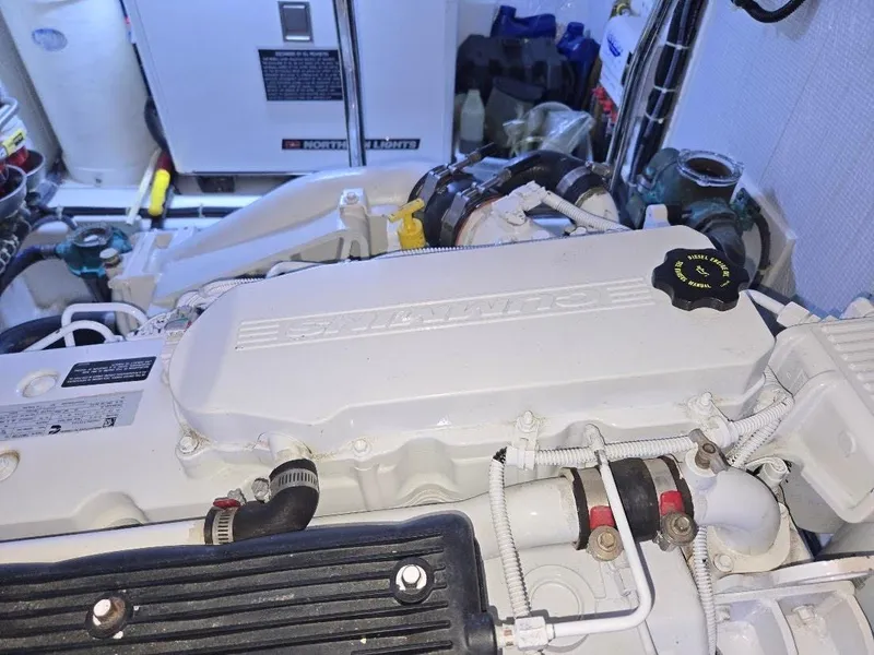 Slide: The Image of Engine room of 2015 American Tug 365 Flybridge, featuring a Cummins engine. - 22