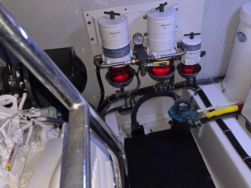 Slide: The Image of Engine room of 2015 American Tug 365 Flybridge with fuel filters and piping. - 26
