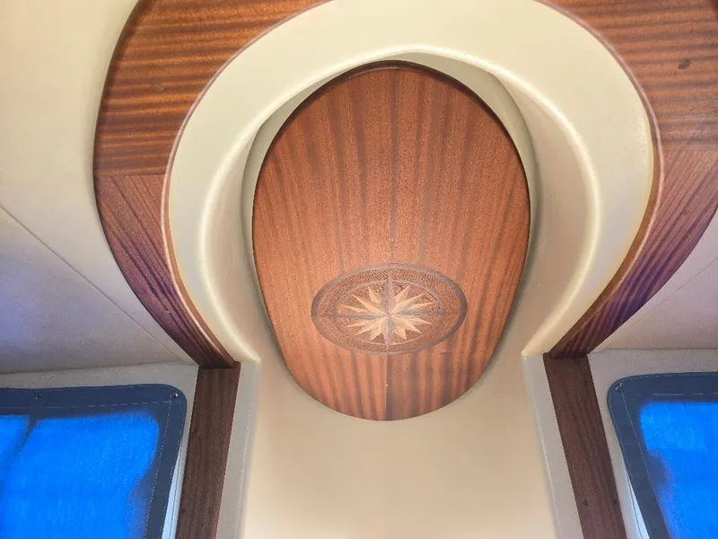 Slide: The Image of Interior ceiling design of 2015 American Tug 365 Flybridge with wood accents. - 31
