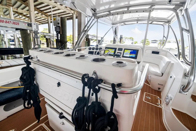Slide: The Image of 2006 Intrepid 377 WA boat interior with helm, seating, and navigation equipment. - 4
