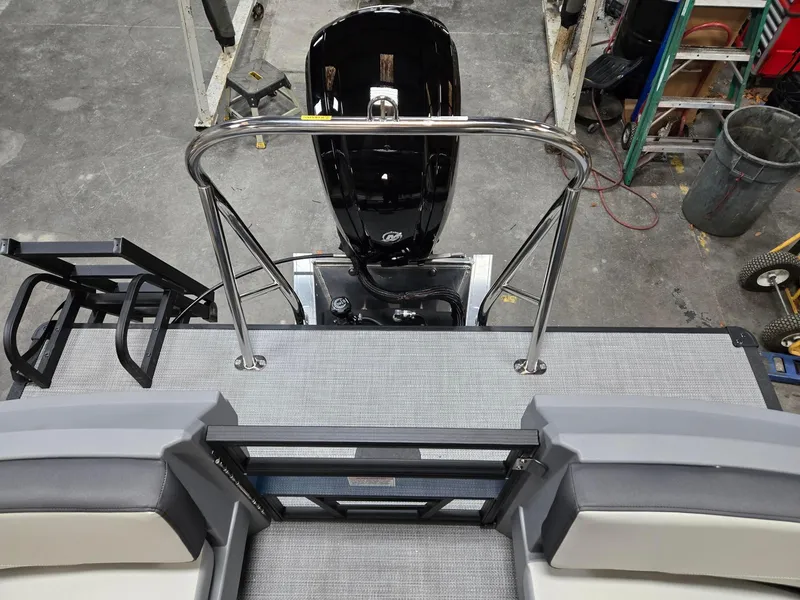 Slide: The Image of 2025 Starcraft GX20R boat deck with motor, featuring sleek design and modern materials. - 10