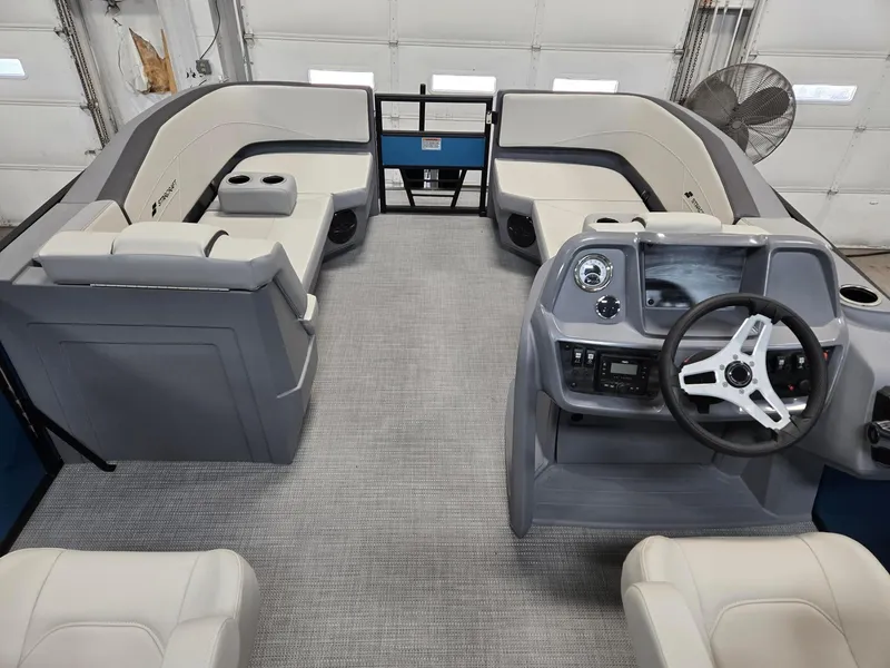 Slide: The Image of 2025 Starcraft GX20R boat interior with modern helm, plush seating, and sleek design. - 3
