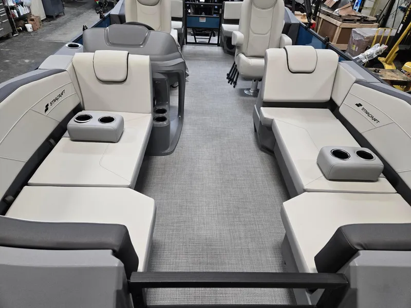 Slide: The Image of Interior of 2025 Starcraft GX20R boat with luxurious seating and cup holders. - 7