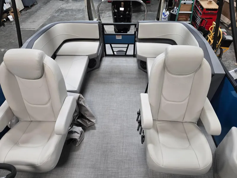 Slide: The Image of Interior of 2025 Starcraft GX20R boat with white leather seating and modern design. - 9