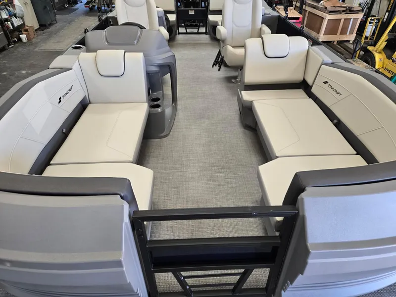 Slide: The Image of 2025 Starcraft GX22R boat interior with beige seating and modern design. - 6
