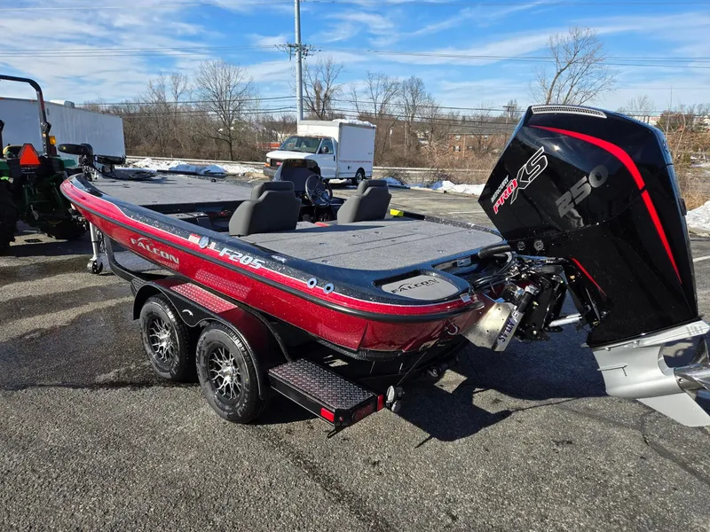 Slide: The Image of 2025 Falcon Boats F205 with powerful engine, parked outdoors on a sunny day. - 3