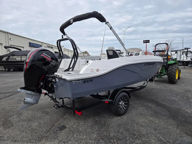 Slide: The Image of 2025 Starcraft SVX191 boat with Mercury engine on trailer in parking lot. - 6