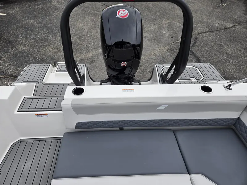 Slide: The Image of 2025 Starcraft SVX191 boat interior with seating and outboard motor. - 7