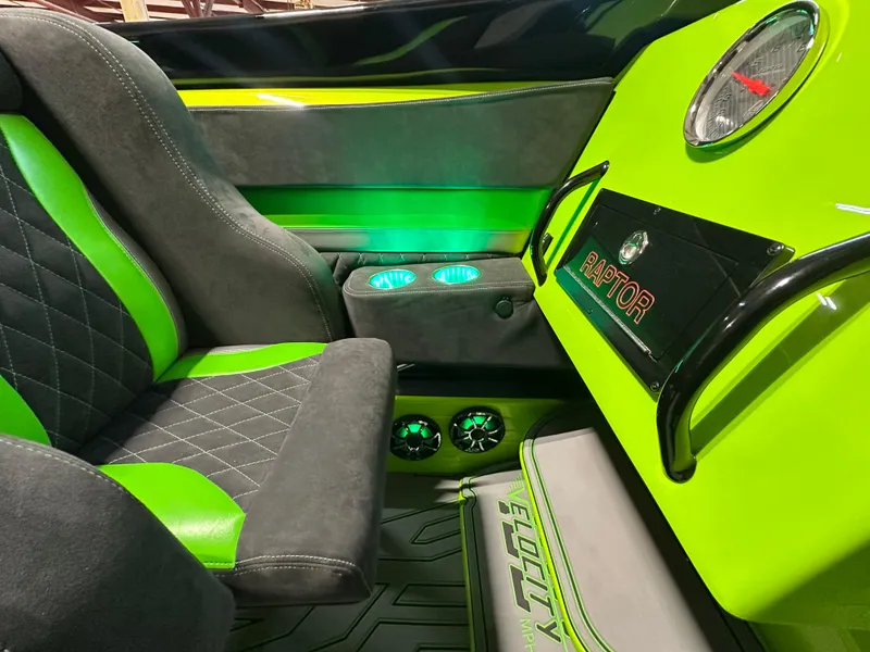 Slide: The Image of Interior of 2025 Velocity 40 RAPTOR with green accents and modern design elements. - 14