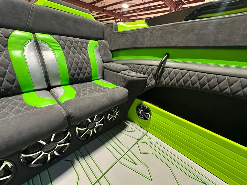 Slide: The Image of Luxurious interior of 2025 Velocity 40 RAPTOR with green accents and premium seating. - 16