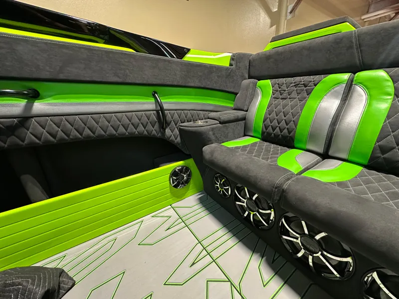 Slide: The Image of Luxurious interior of 2025 Velocity 40 RAPTOR with green and black seating and speakers. - 17