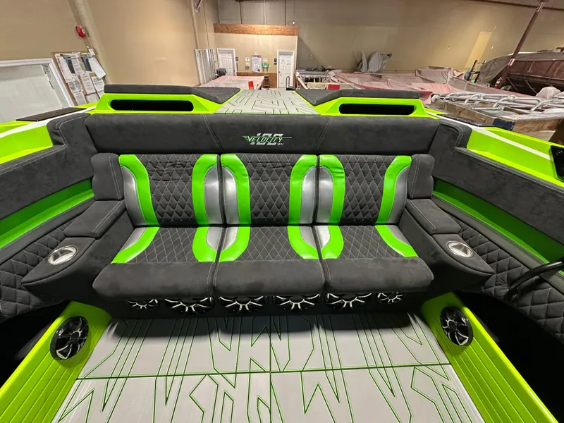 Slide: The Image of Interior of 2025 Velocity 40 RAPTOR boat with green and black seating. - 18