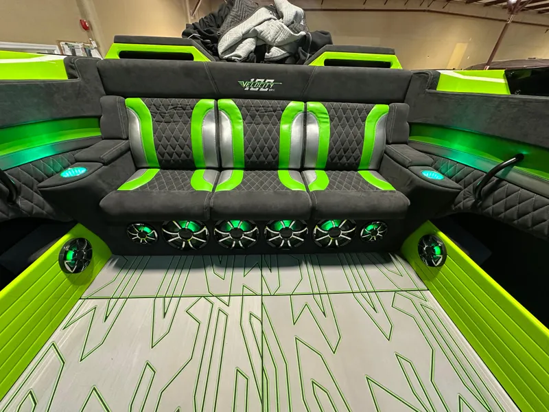 Slide: The Image of Luxurious interior of 2025 Velocity 40 RAPTOR boat with green accents and premium seating. - 19