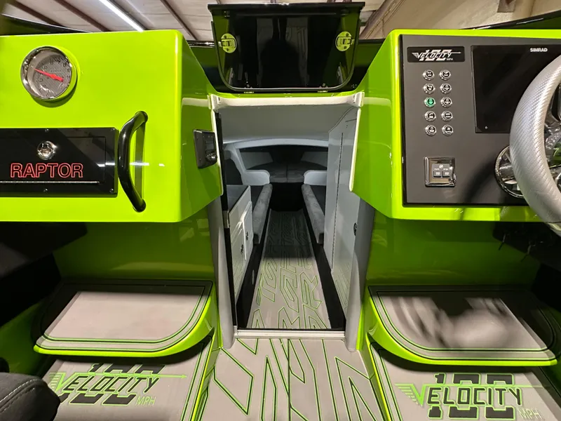 Slide: The Image of Interior of 2025 Velocity 40 RAPTOR boat, featuring vibrant green design and modern dashboard controls. - 31
