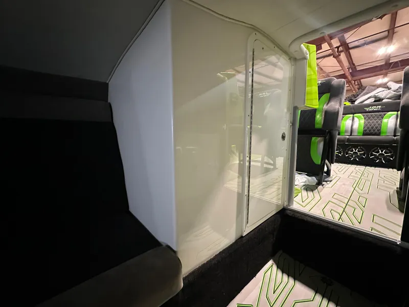 Slide: The Image of Interior of 2025 Velocity 40 RAPTOR with modern seating and stylish green accents. - 41