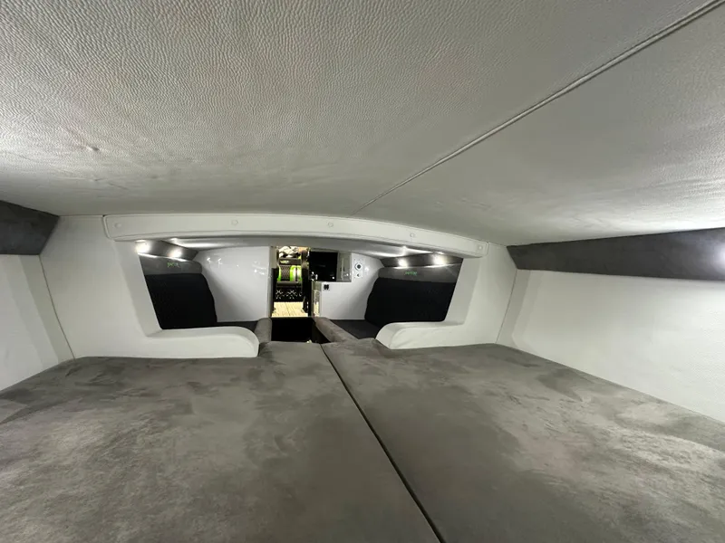 Slide: The Image of Interior cabin of 2025 Velocity 40 RAPTOR boat, featuring plush seating and modern lighting. - 44