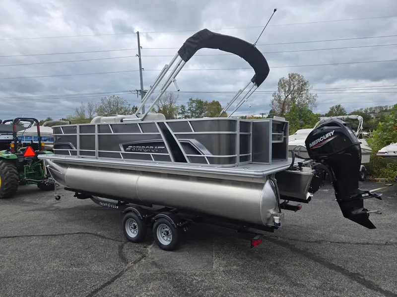 Slide: The Image of 2025 Starcraft EX20FD4 pontoon boat on trailer with Mercury outboard motor. - 4