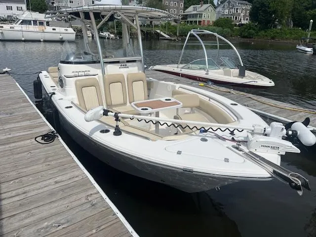 The Image of 2017 Sea Fox 249 Avenger boat docked, featuring a spacious deck and modern design. - 0