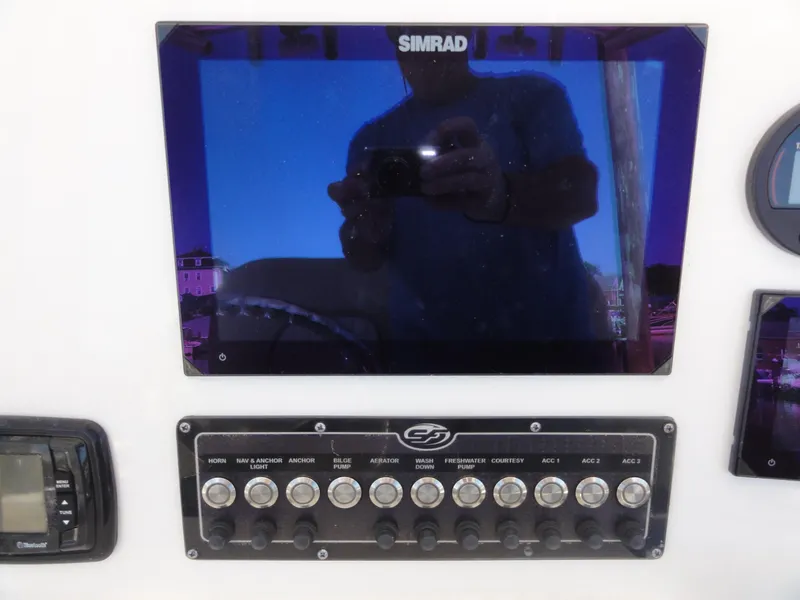 Slide: The Image of 2017 Sea Fox 249 Avenger dashboard with Simrad display and control panel. - 15