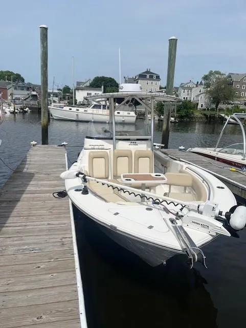 Slide: The Image of 2017 Sea Fox 249 Avenger docked at a marina, featuring a sleek design and spacious seating. - 22