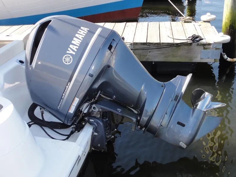 Slide: The Image of Yamaha outboard motor on 2017 Sea Fox 249 Avenger boat, docked by wooden pier. - 6