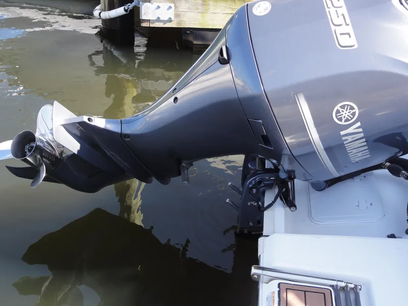 Slide: The Image of Outboard motor on 2017 Sea Fox 249 Avenger boat, docked in water. - 8