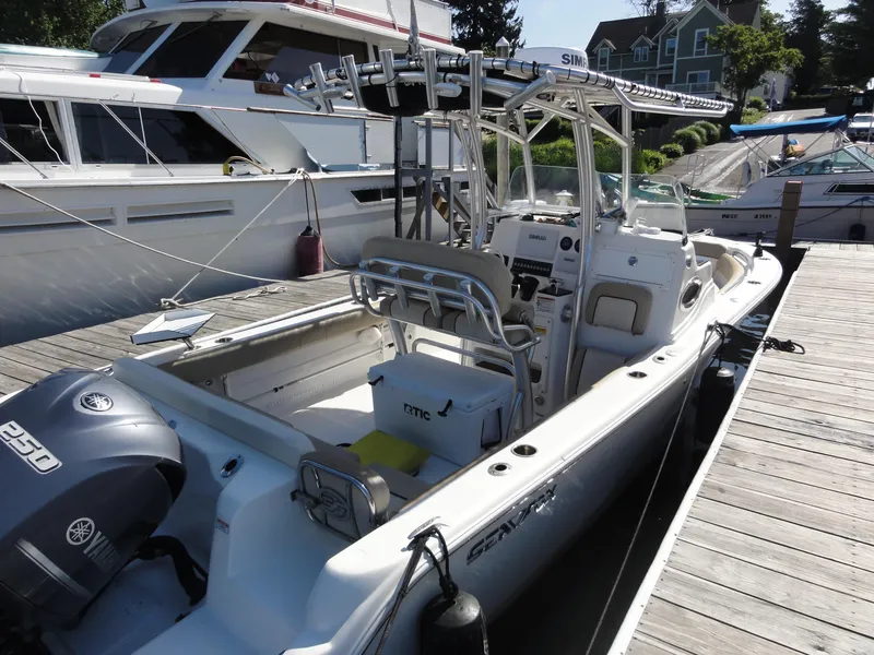 Slide: The Image of 2017 Sea Fox 249 Avenger boat docked, featuring Yamaha 250 engine and fishing equipment. - 9