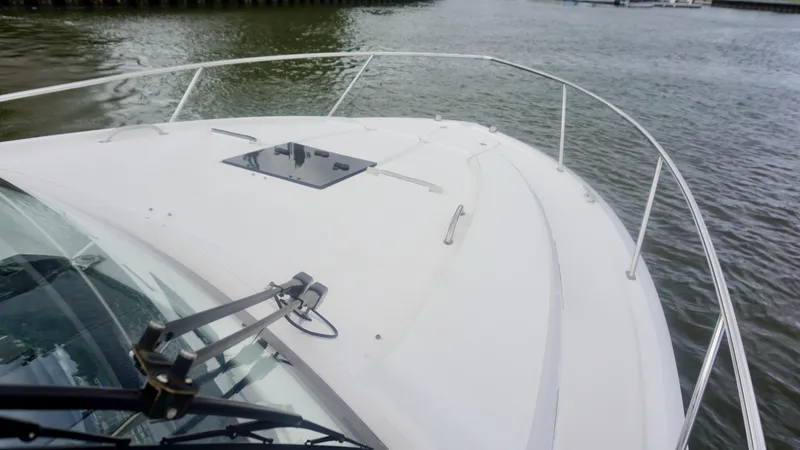 Slide: The Image of 2018 Pursuit OS 355 Offshore boat deck on calm water. - 7