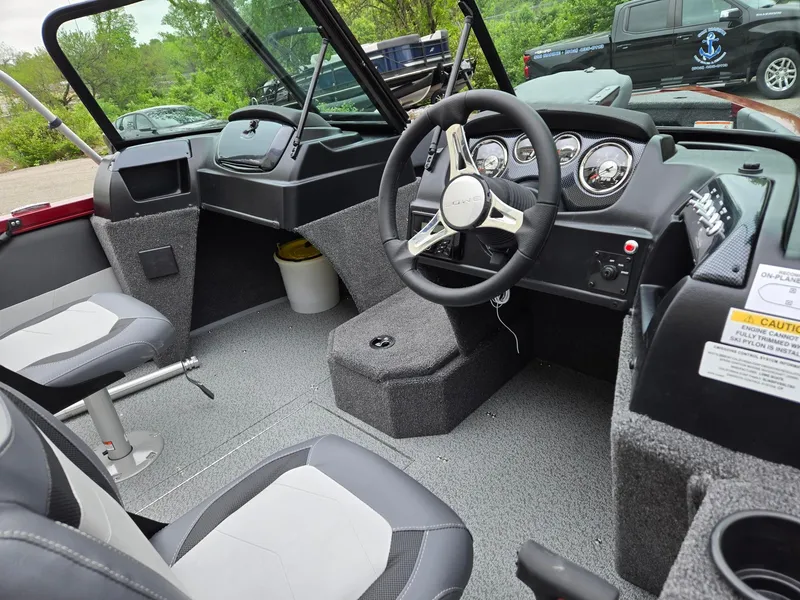 Slide: The Image of Interior of 2025 Lowe FS1800 boat with steering wheel and seating. - 3