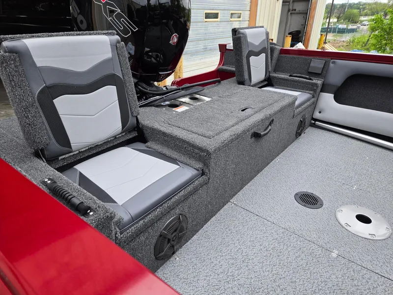 Slide: The Image of Interior of a 2025 Lowe FS1800 boat with gray seating and storage compartments. - 6